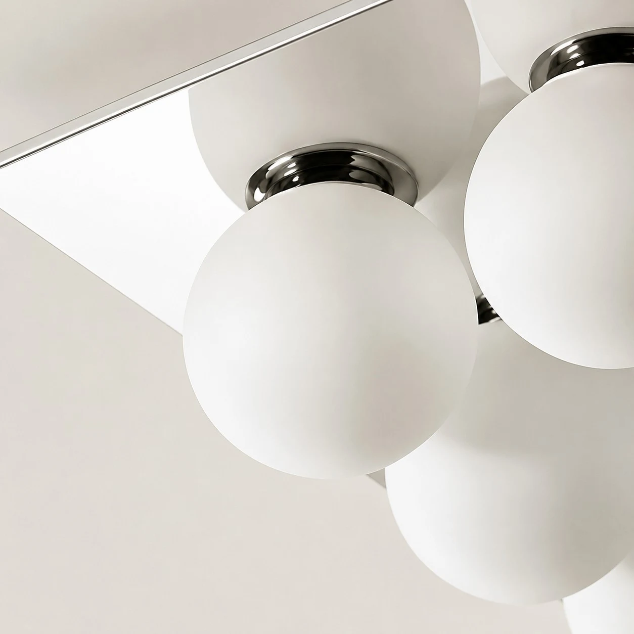 Detail image: close view of chrome fitting and glass diffuser.