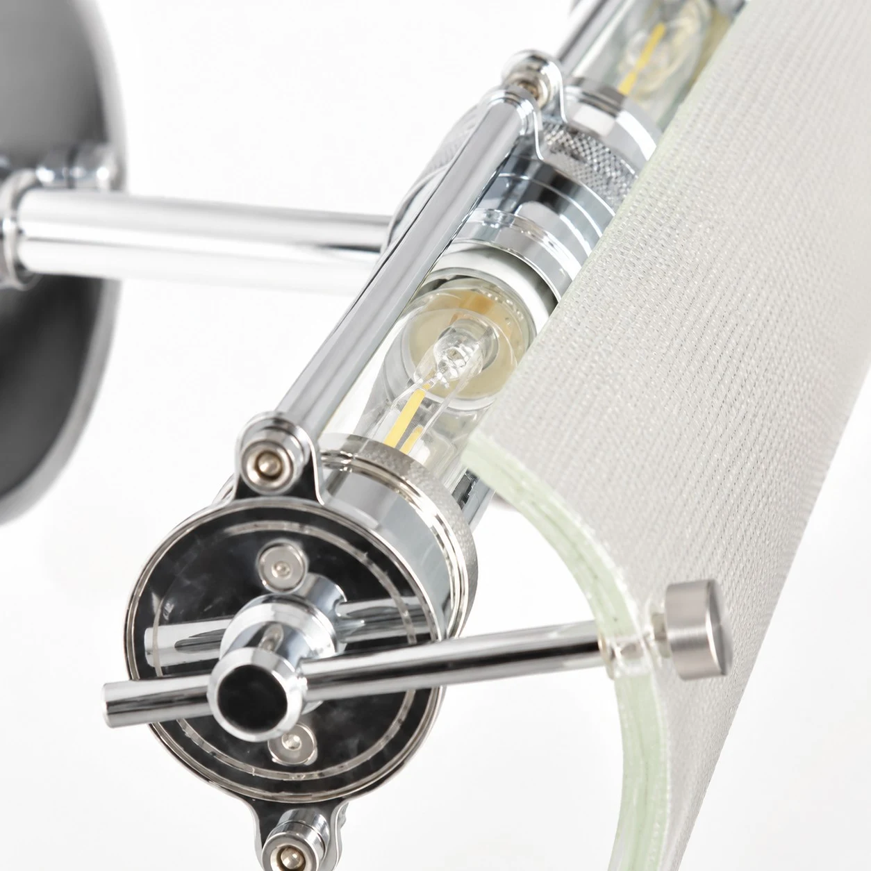 Close detail of the ribbed glass shade and metal bracket
