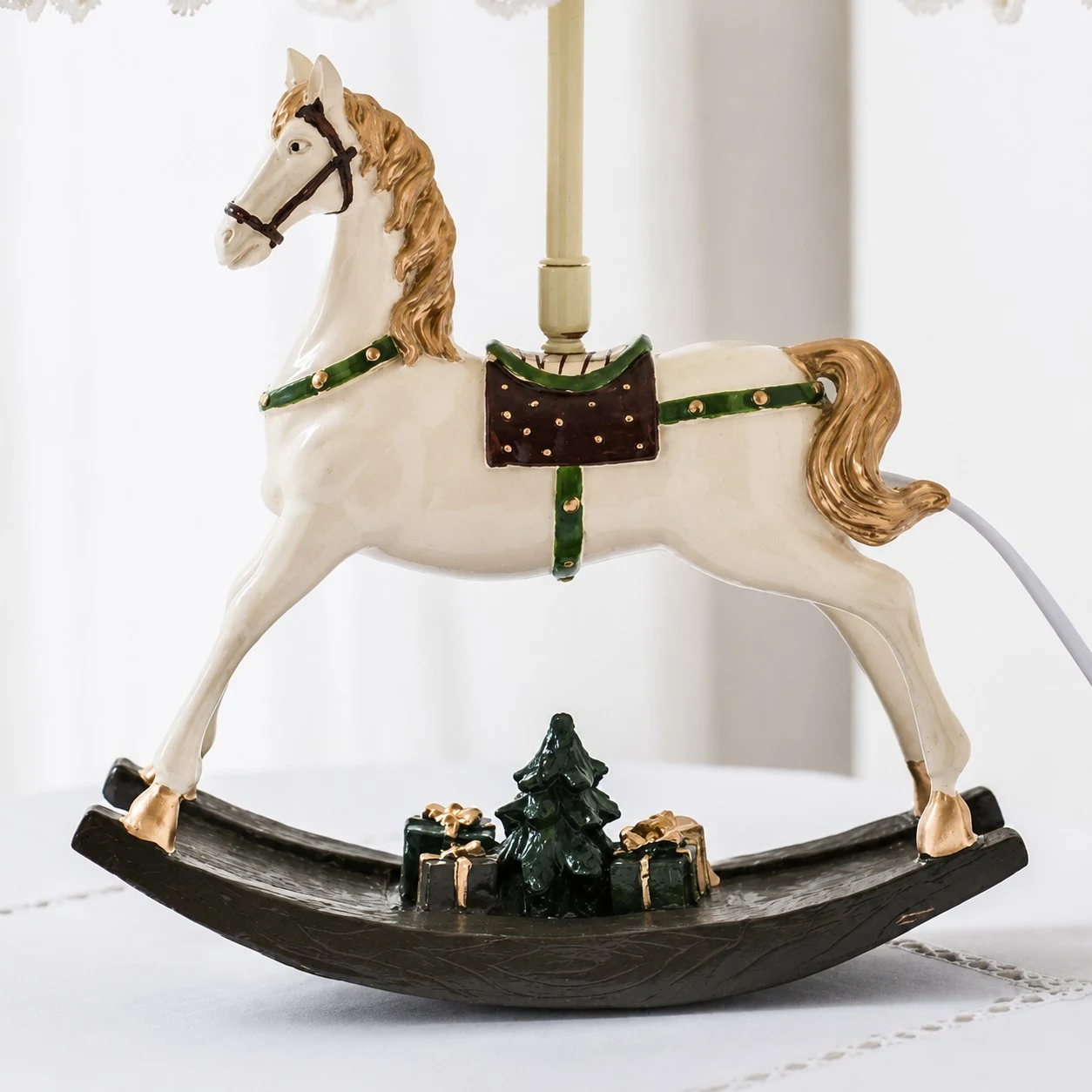 Rocking horse lamp base with painted saddle and holiday gift details