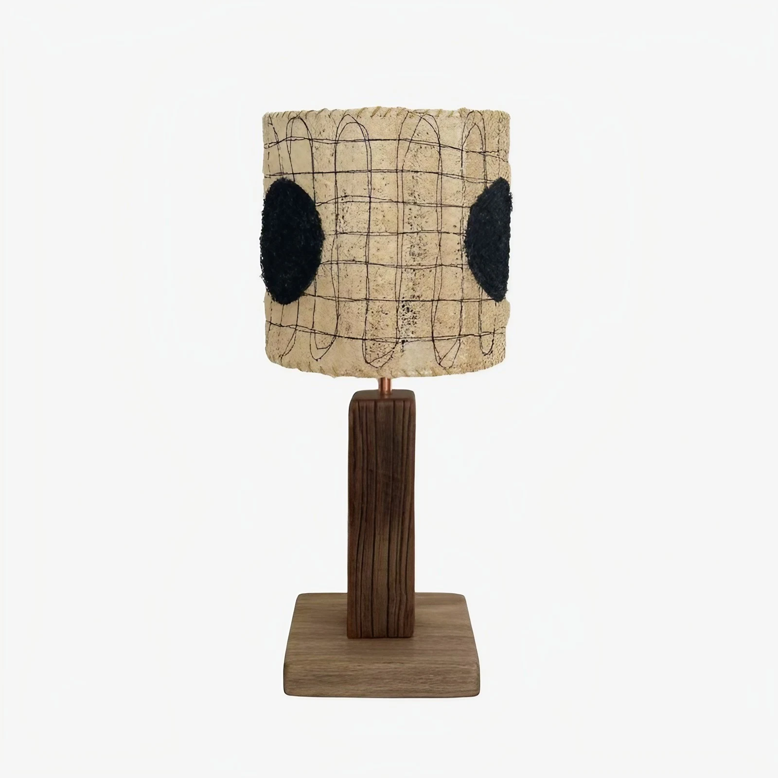 Black dot shade loofah table lamp on a white background