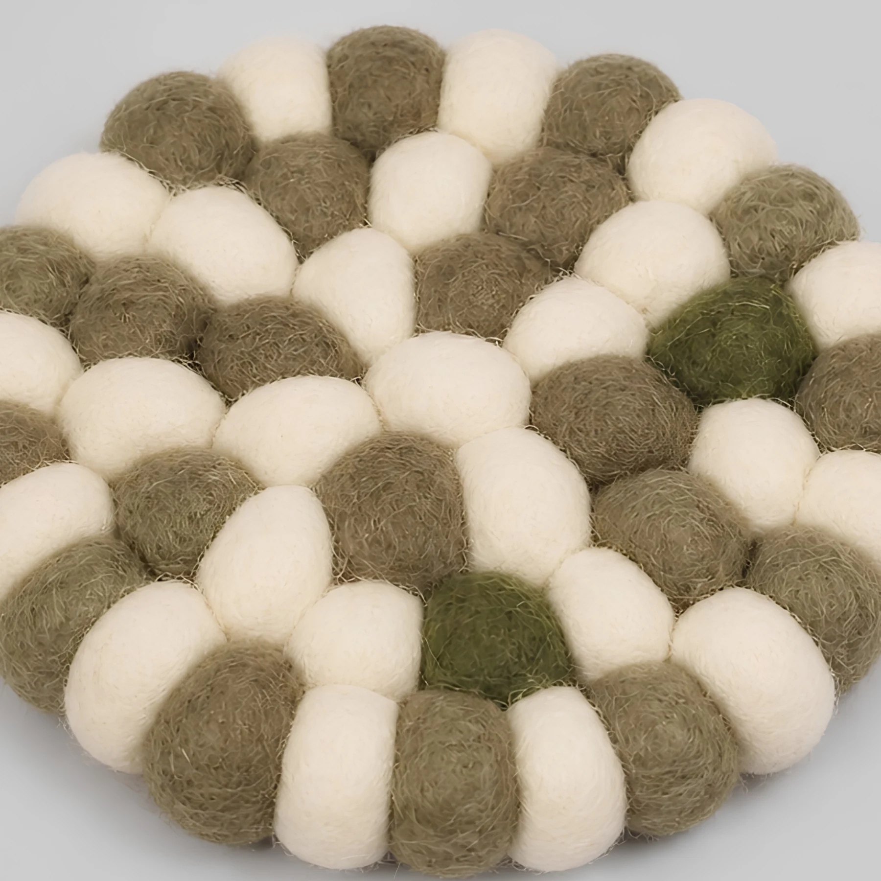 Close view of handmade wool felt ball texture