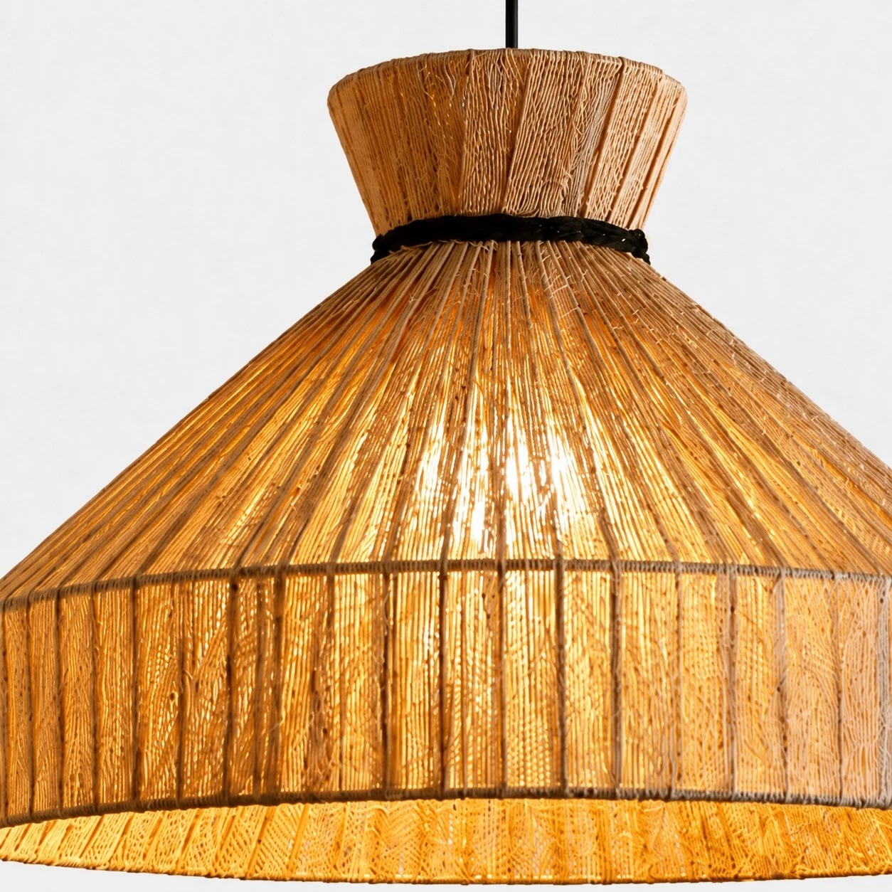 Close-up of woven fabric shade with warm light diffusion