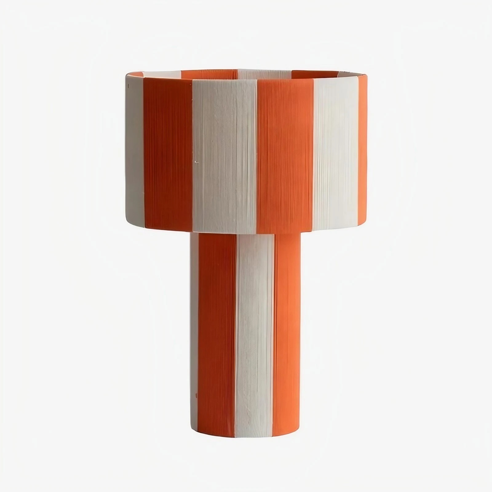 Orange and white striped woven shade table lamp on a white background
