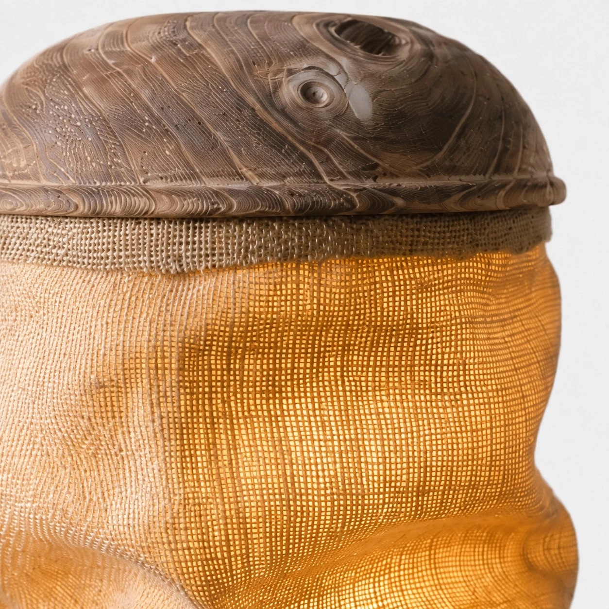 Close-up of gathered linen shade and top wood cap