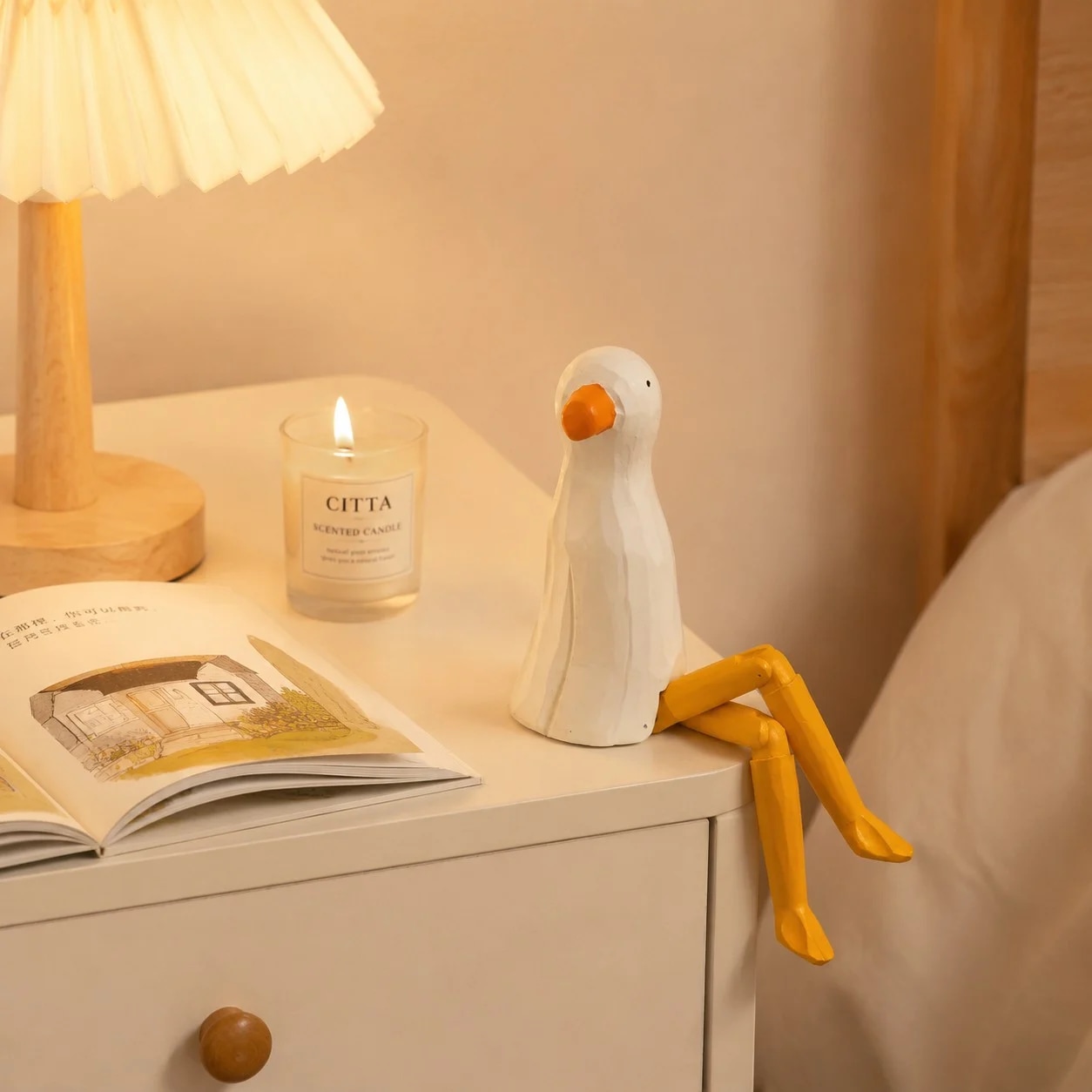 Hand-carved wooden seagull ornament styled on a tabletop edge