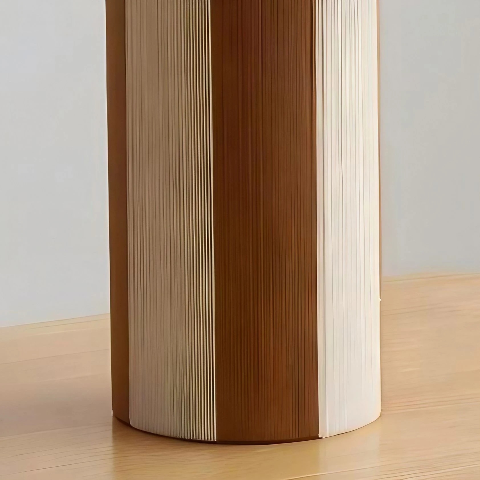 Cylindrical striped table lamp base with woven panel texture