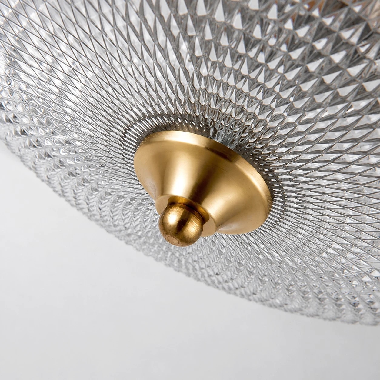 Textured glass shade and brass cap detail