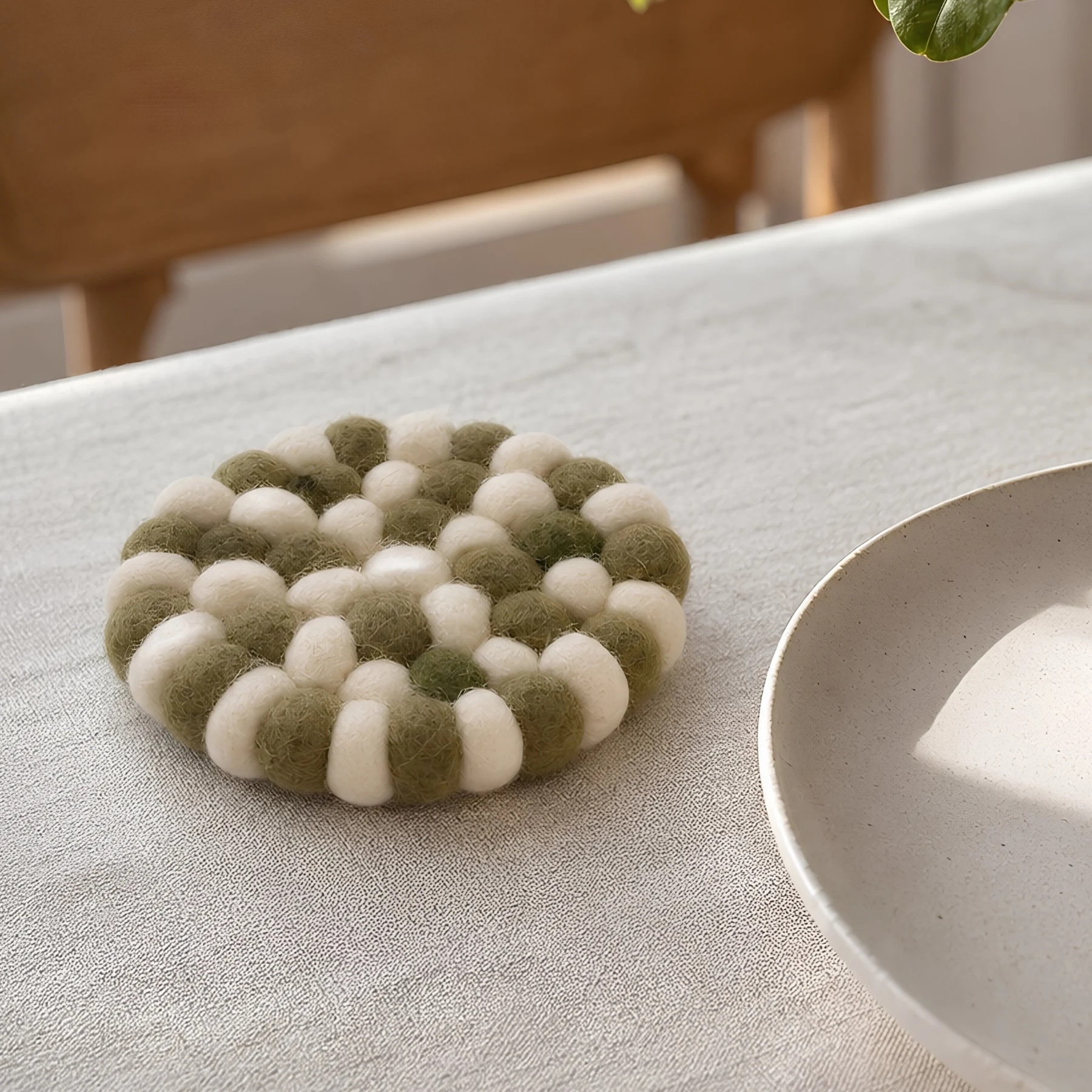 Handmade felt coaster on a dining table
