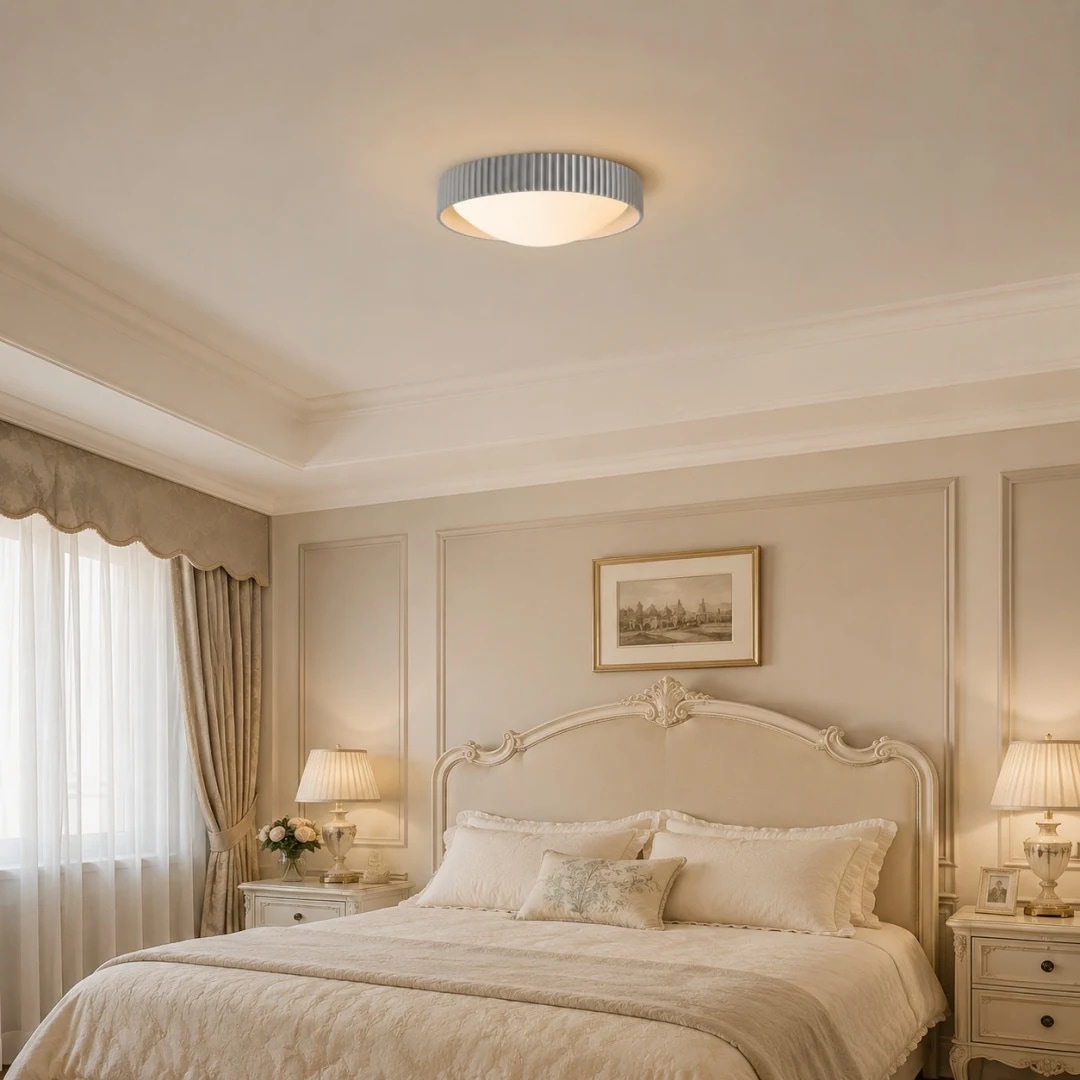 Gray flush mount ceiling light in a soft bedroom setting