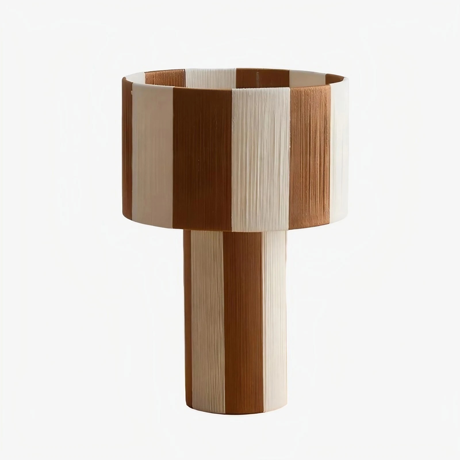 Coffee and white striped woven shade table lamp on a white background