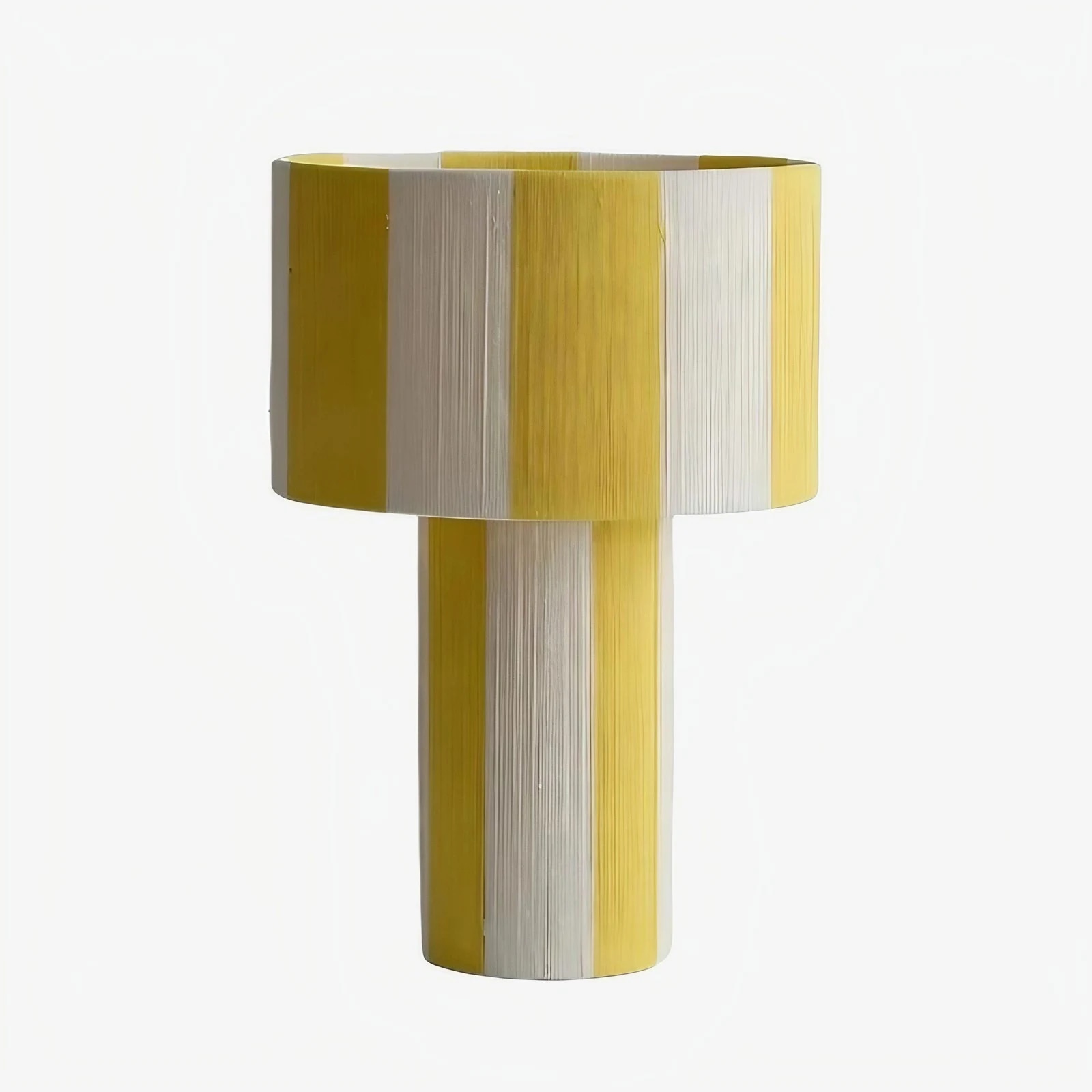Yellow and white striped woven shade table lamp on a white background