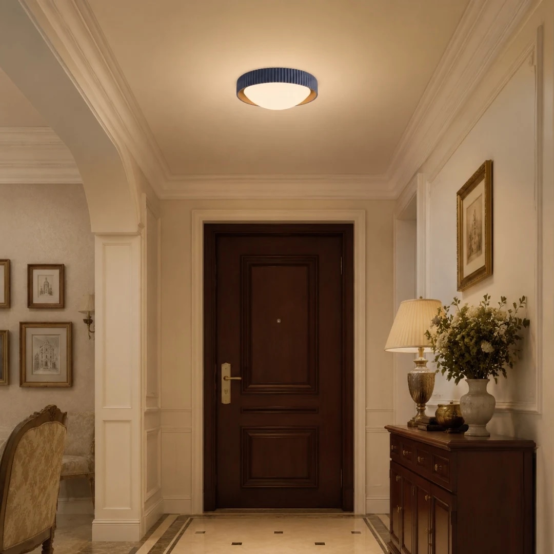 Blue ceiling light casting warm light in an entryway