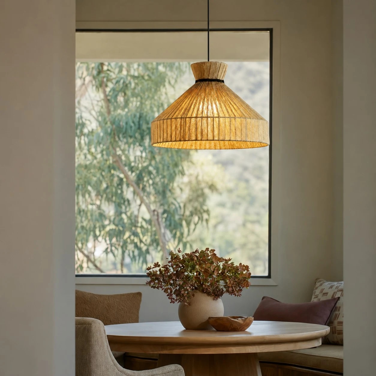 Fabric cone pendant light in a warm window nook