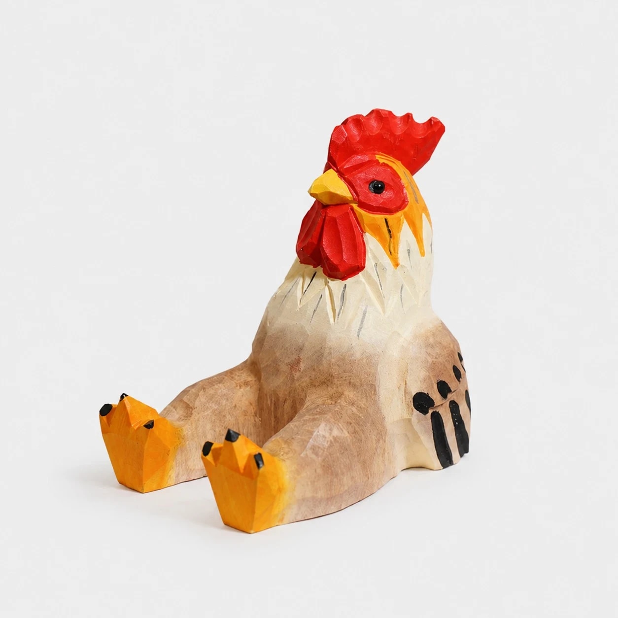 Hand-carved wooden animal phone stand