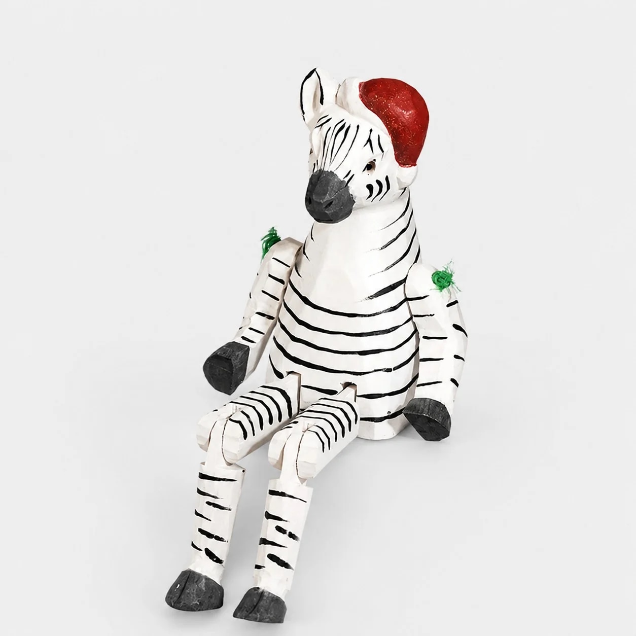 Hand-carved wooden zebra with santa hat ornament