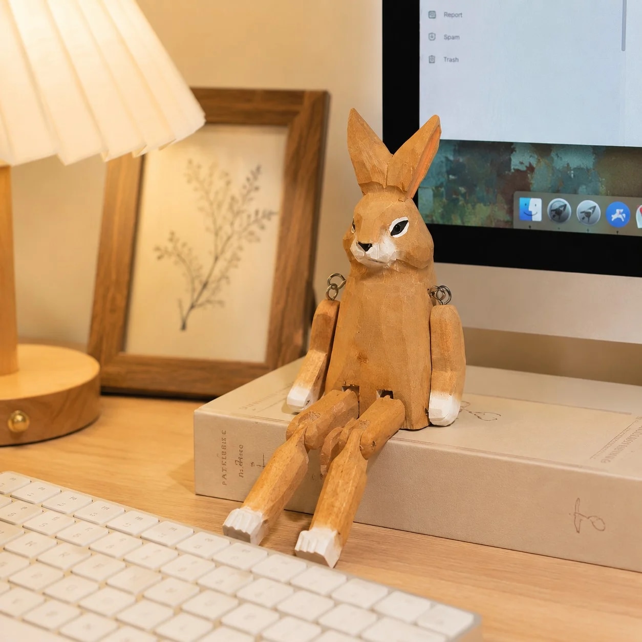 Hand-carved wooden rabbit ornament styled on a tabletop edge