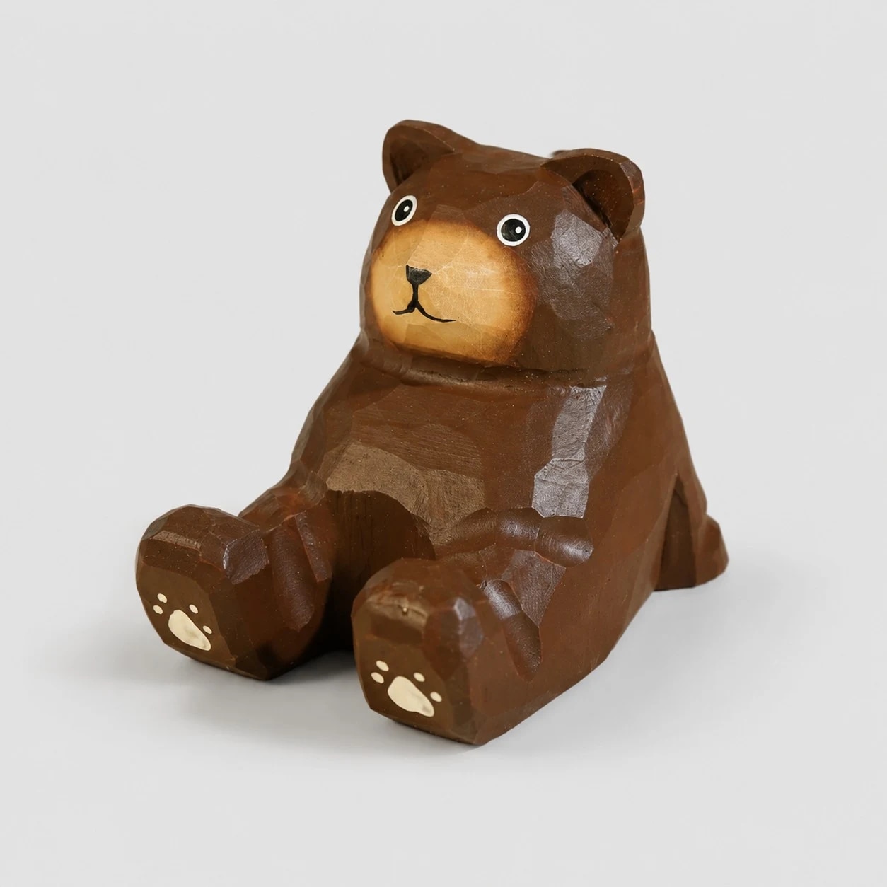 Hand-carved wooden animal phone stand