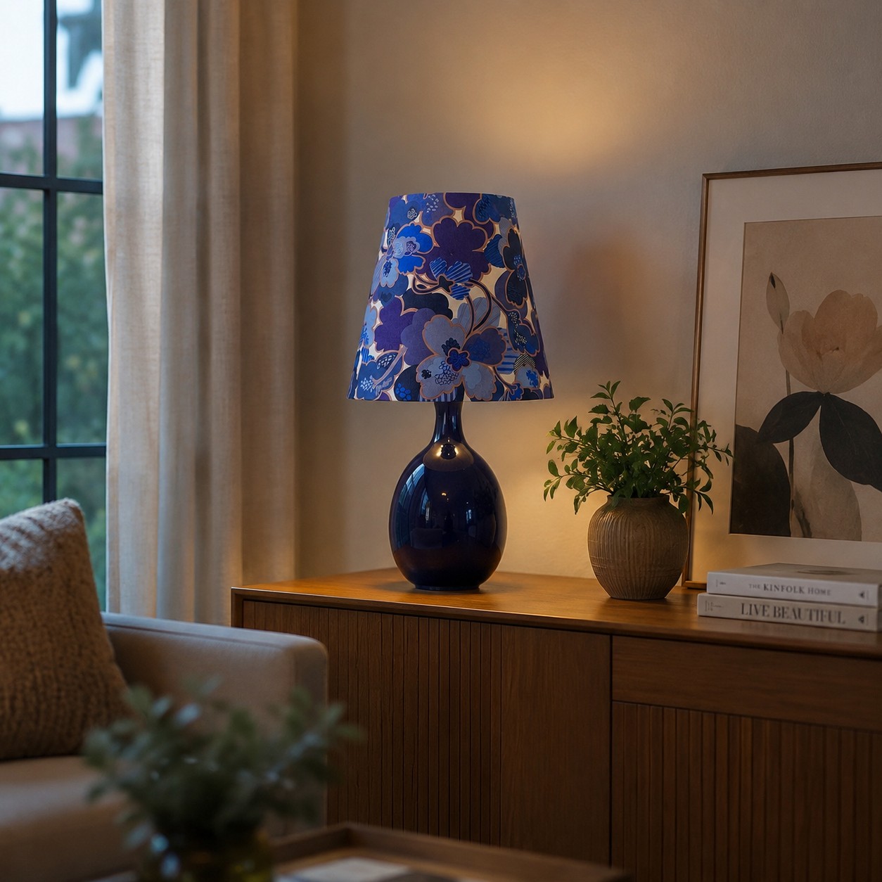Blue floral ceramic table lamp styled near a window